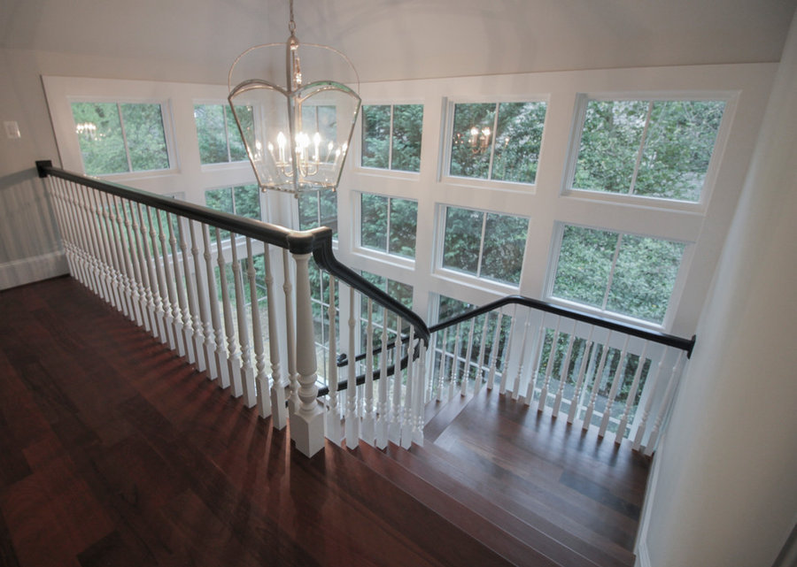 Powerful Impression by Floating Staircase in Suburban Foyer