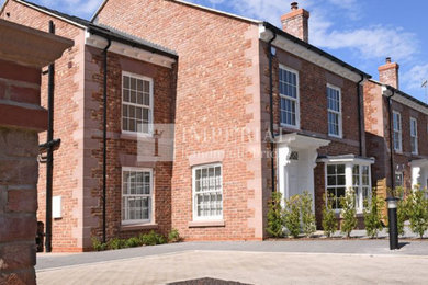 Large and red traditional two floor brick detached house in Cheshire.