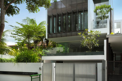 Large contemporary three-storey white exterior in Singapore.