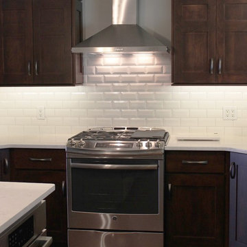 Bettendorf, IA- Kitchen in Dark Mocha Cabinetry With Painted Gray Accent Island