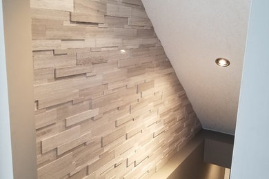 Example of a mid-sized carpeted straight wood railing staircase design in Calgary with carpeted risers
