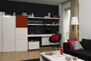 Living room - mid-sized modern formal and enclosed living room idea in Other with white walls