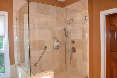 Inspiration for a small mediterranean master beige tile and stone tile ceramic tile bathroom remodel in Columbus with recessed-panel cabinets, black cabinets, a two-piece toilet, beige walls and an integrated sink