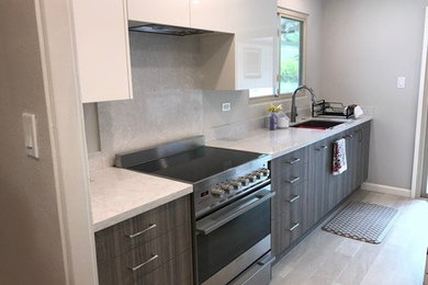 Inspiration for a contemporary ceramic tile and white floor kitchen remodel in Hawaii with an undermount sink, quartzite countertops, white backsplash, stainless steel appliances and white countertops
