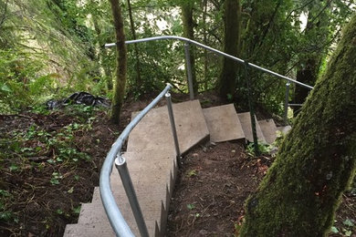 concrete stairs down hillside to beach