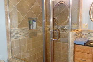 Example of a transitional beige tile and porcelain tile bathroom design in Huntington