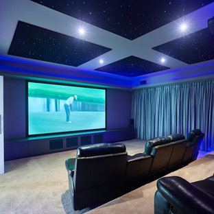 Example of a large classic enclosed carpeted home theater design in Brisbane with gray walls and a projector screen