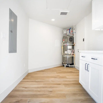 Utility Room with Heat Pump Water Heater and Storage Cabinets – Beacon Hill