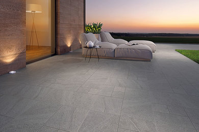 Example of a large trendy backyard tile patio design in San Diego with no cover