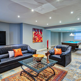 This is an example of a large contemporary look-out basement in Philadelphia with blue walls, slate flooring, multi-coloured floors and no fireplace.