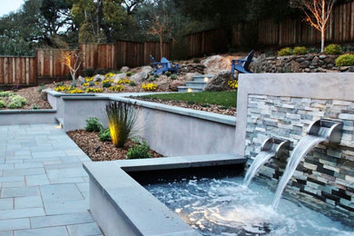 Inspiration for a contemporary courtyard stone retaining wall landscape in San Francisco.