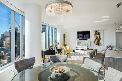 Example of a small trendy open concept medium tone wood floor and brown floor living room design in San Francisco with white walls, a hanging fireplace, a metal fireplace and a wall-mounted tv
