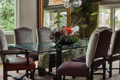 Large medium tone wood floor enclosed dining room photo in Denver