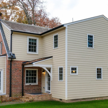 Classic Colonial Exterior with Cream Hardie Siding and Brick Accents