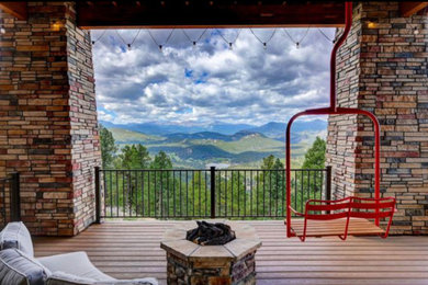 Mountain style deck photo in Denver with a fire pit