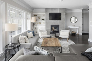 Living room - modern open concept living room idea in Vancouver with gray walls, a standard fireplace, a tile fireplace and a wall-mounted tv