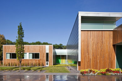 Example of a trendy wood exterior home design in Omaha