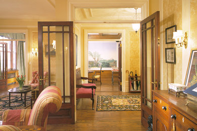 Inspiration for a timeless medium tone wood floor living room remodel in New York