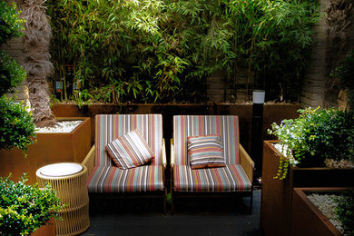 Inspiration for a medium sized contemporary back terrace in London.