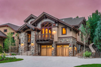 Home design - large rustic home design idea in Denver