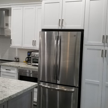 Two Toned Kitchen Full Remodel featuring White & Gray Cabinetry and Granite tops