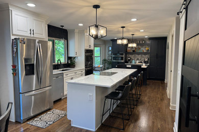 Inspiration for a mid-sized transitional kitchen remodel in Denver with two islands