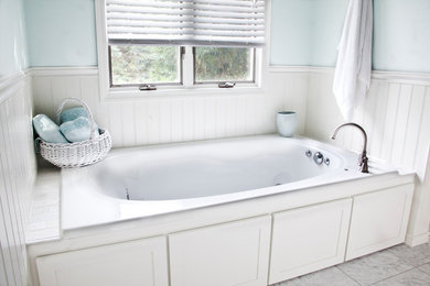 Bathroom - traditional white tile and ceramic tile marble floor bathroom idea in Milwaukee with shaker cabinets, white cabinets, a two-piece toilet, blue walls and an undermount sink