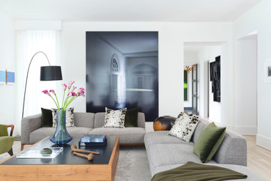Inspiration for a large contemporary open concept light wood floor living room remodel in Atlanta with white walls, no fireplace and no tv