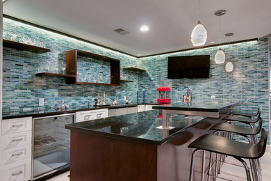 This is an example of a large contemporary u-shaped seated home bar in Denver with porcelain floors, shaker cabinets, white cabinets, blue splashback and matchstick tile splashback.