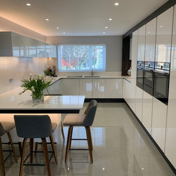 White Gloss Handles Minimalist G Shaped Kitchen