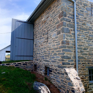 Restoration and tuckpointing of a 1778 stone barn.
