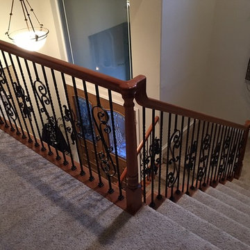 Metal Baluster Stairs with alternating Scroll and Oak Leaf details