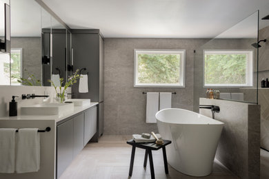 Inspiration for a large modern master beige tile double-sink bathroom remodel in Boston with flat-panel cabinets, gray cabinets, quartz countertops, white countertops and a floating vanity