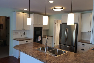 Example of a classic kitchen design in Other