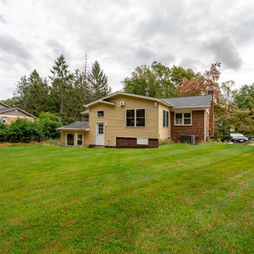 Cheerful Multi Level Rear Addition to Expand Kitchen, Mudroom & Sunroom in Oakt