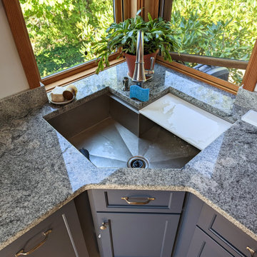 Custom Stainless Corner Workstation Sink in a Blue Kitchen