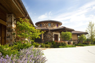 Example of a tuscan exterior home design in Wichita