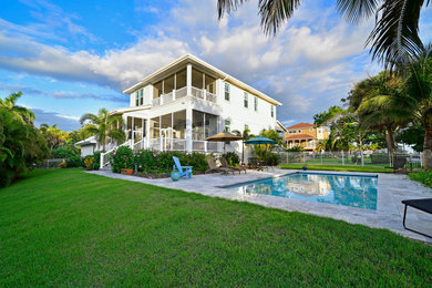 Beach style home design photo in Tampa