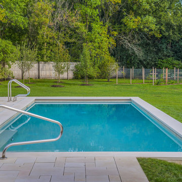 Limestone Pool Deck Surrounding Rectangular Raised Pool