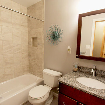 Guest Bathroom Gingersnap Cabinets with Danya Ceramic Tiled Shower