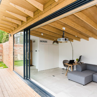 Design ideas for a modern home office and library in London.