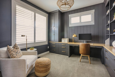 Example of a transitional home office design in Minneapolis
