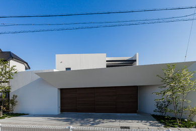 Example of a mid-sized minimalist white two-story house exterior design in Other