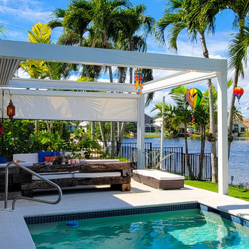 Retractable Pergola with Motorized Screens on Poolside Patio
