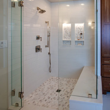 Luxury Spa Bathroom with Natural Warm Vanities, Quartz Countertop, Tiled Shower