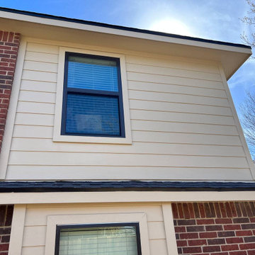 Primed James Hardie Siding in Universal Khaki.