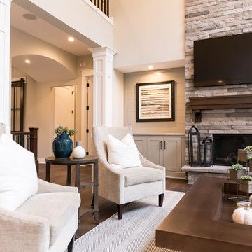 Living Room Remodel Featuring a Ledgestone Fireplace + Cabinetry + Shaw Coretec