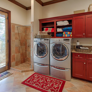 Inspiration for a traditional utility room in Other with red cabinets.