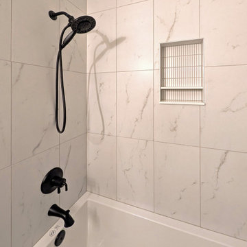 Panoramic Penthouse: Marble-Pattern Tub with Matte-Black Shower Hardware