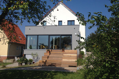 Large contemporary two floor detached house in Other with a pitched roof.